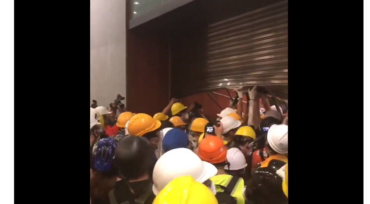 Hong Kong police storm mall after protesters smash rail station