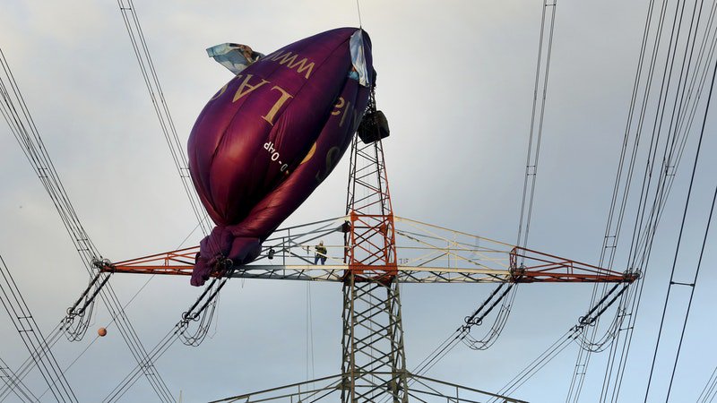 Six rescued from hot air balloon that collided with power line tower in Western Germany