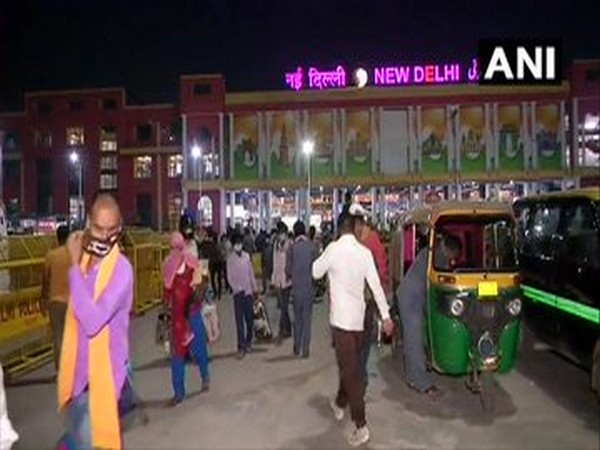 Passengers await departure from New Delhi railway station after resumption of trains