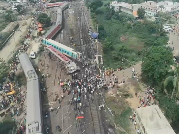 Rescuers try to raise buried coach at triple rail crash site as death toll is 261