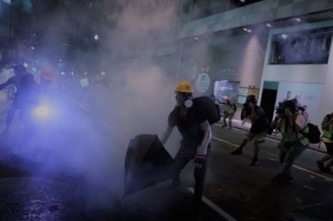 WRAPUP 1-Hong Kong police in position at airport ahead of planned protest