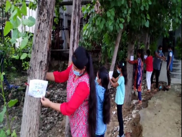 Students tie rakhis on trees with 'Save Environment' messages in Moradabad