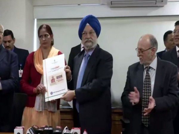 Hardeep Singh Puri hands overs registry papers to 20 unauthorised colony residents of Delhi