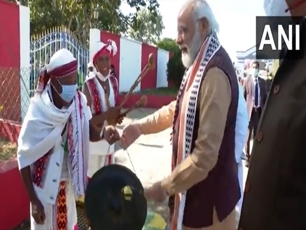 Manipur: PM Modi tries his hand at playing traditional musical instruments during visit to Imphal