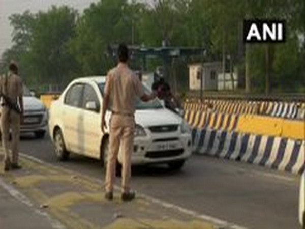 Police personnel screen vehicles at Delhi borders
