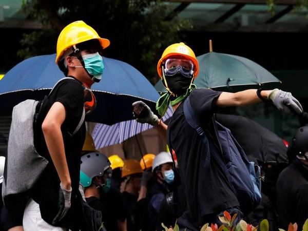 Protesters march in twin demonstrations ahead of general strike in Hong Kong