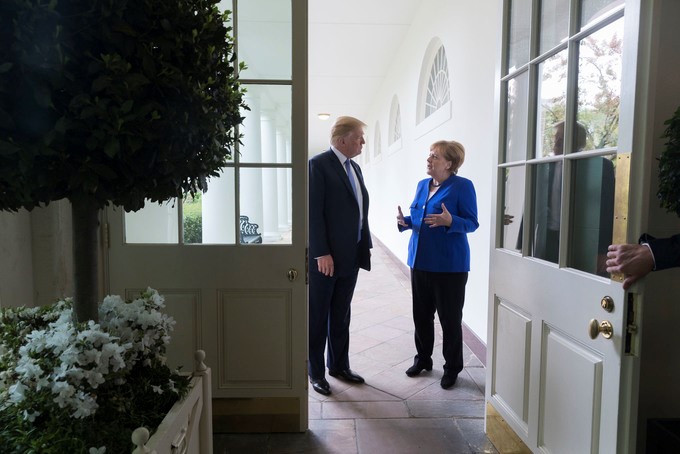 Trump meets Germany's Merkel marking 75th anniversary of D-Day