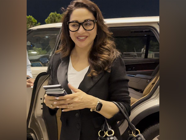 Madhuri Dixit Nene Stuns at Mumbai Airport; Announces USA Tour