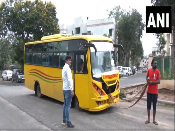 School Bus Stranded in Pothole Amidst Gujarat's Heavy Rains, No Casualties Reported