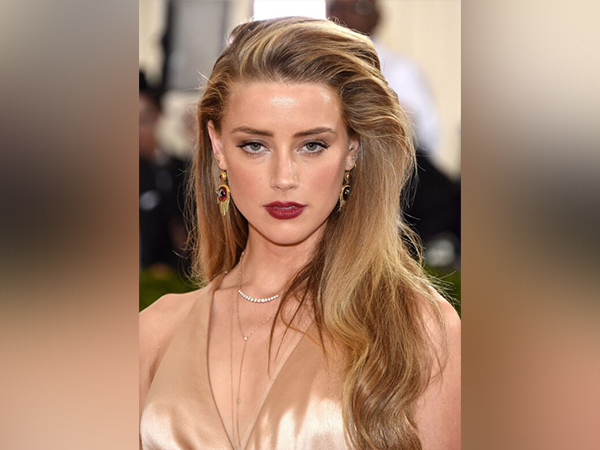 Amber Heard moved to Madrid?