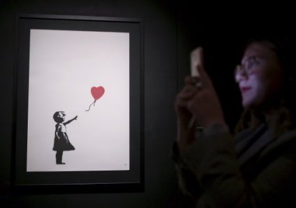 UPDATE 1-"We just got Banksy-ed": balloon girl painting self-destructs at sale