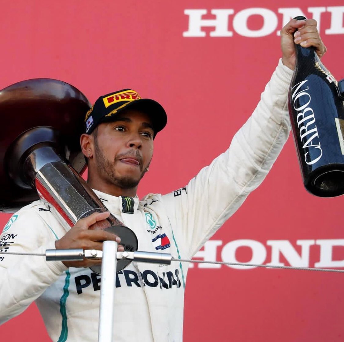 UPDATE 2-Motor racing-Hamilton on brink of fifth title after Japan win