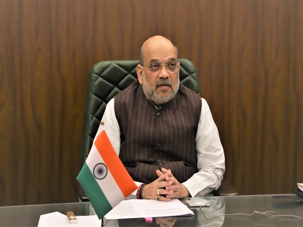 Shah congratulates Modi on completing 20 years of public service