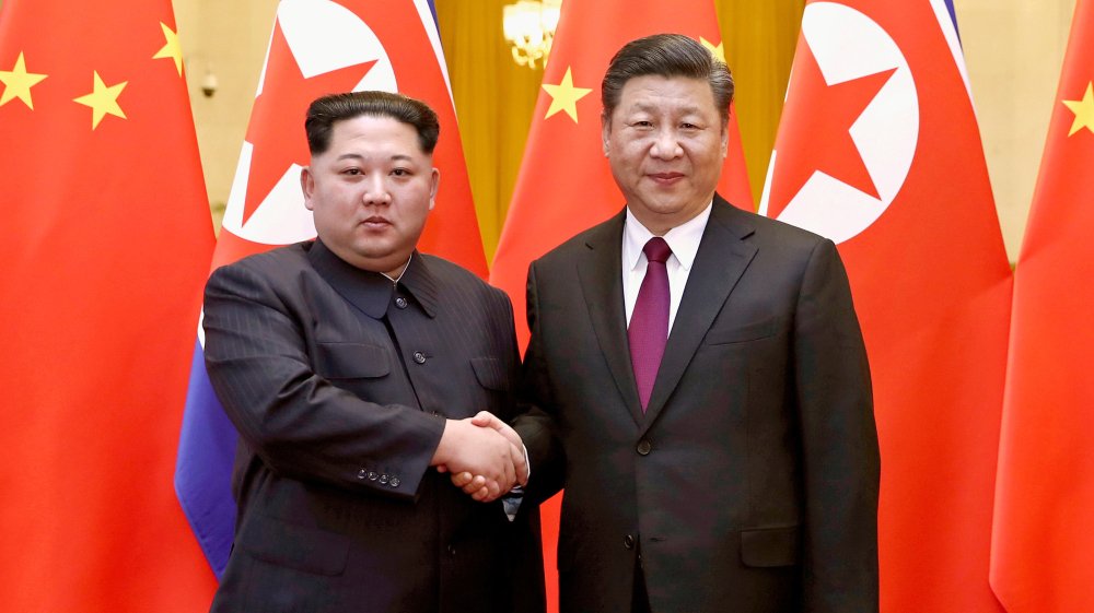 WRAPUP 1-China's Xi nudges N.Korea, U.S. to meet half way as second summit planned