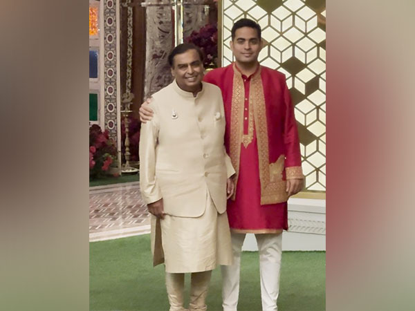 Mukesh Ambani poses with son Akash Ambani at Anant-Radhika's haldi ceremony