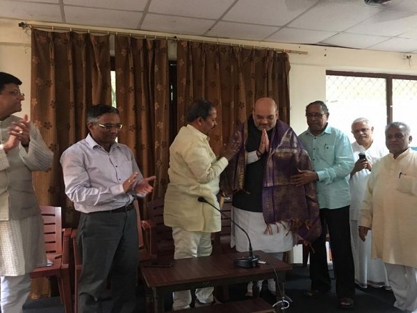 Amit Shah visits Bharatiya Mazdoor Sangh headquarters, assures talks for welfare of workers