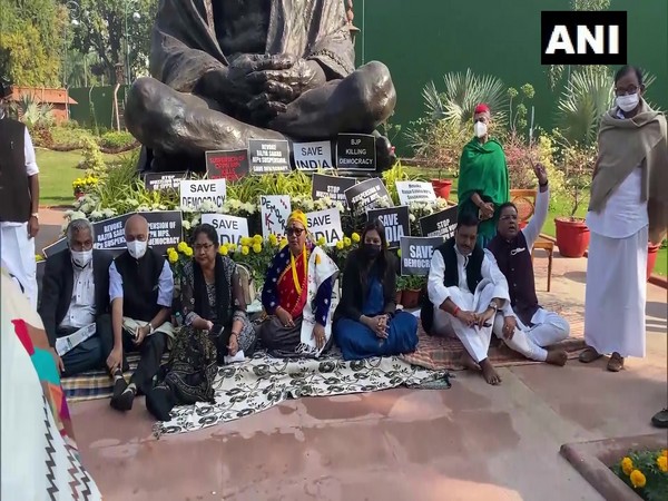 Suspended Opposition MPs continue to protest at Gandhi statue in Parliament