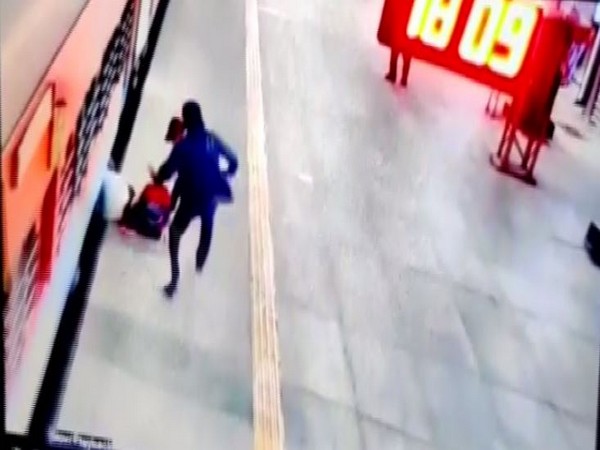 Clerk saves woman stuck in space between train, platform