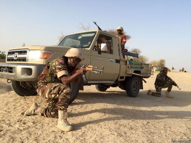 UPDATE 1-Nigerian military raids paper after Boko Haram article