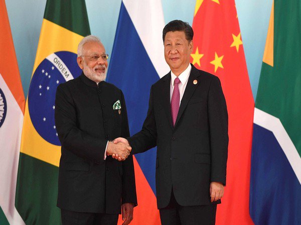 UPDATE 1-India's Modi to host China's Xi at summit with ties strained by Kashmir