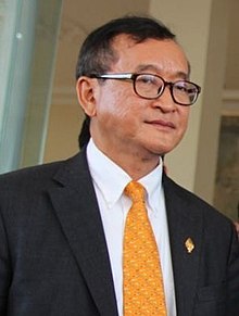 UPDATE 1-Cambodian opposition figure Sam Rainsy boards plane in Paris