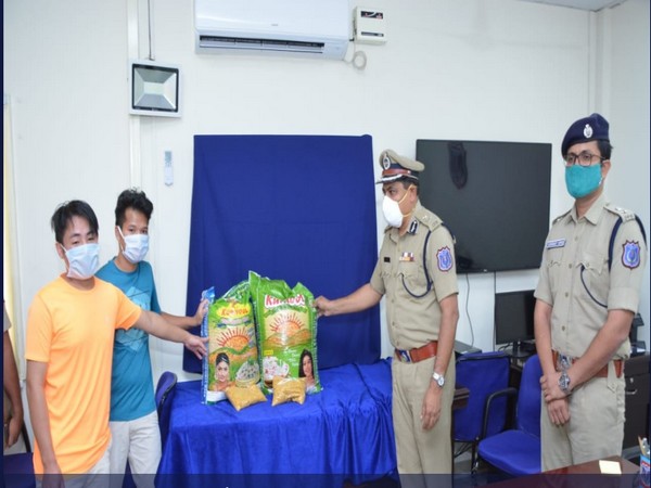 Rachakonda Police Commissioner hands over  rice, pulses to Manipur students who were denied entry to supermarket