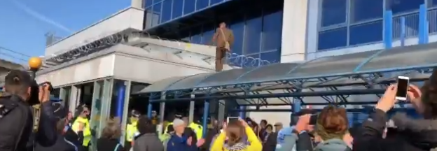 Man climbs on roof of London City Airport, shouts 'shut this airport down'