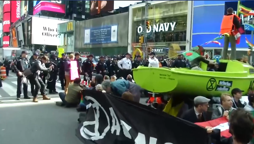 Climate protesters block New York's Times Square; police threatens arrests