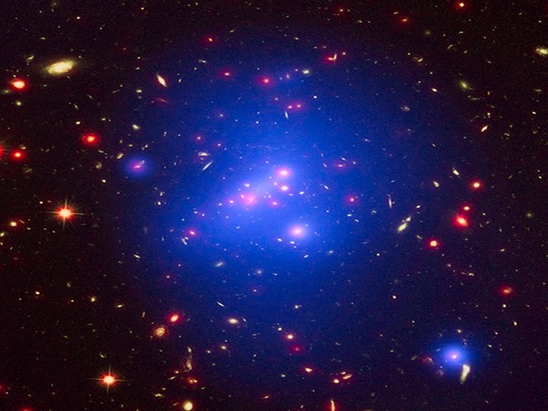 Astronomers discover dozen quasars warped by naturally occurring cosmic 'lens'