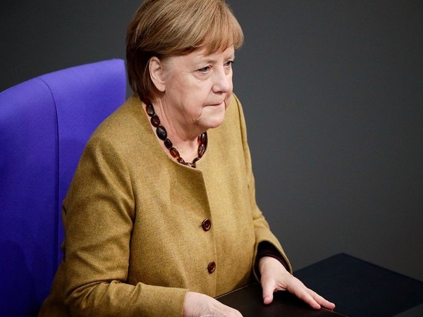 Emotional Merkel, marking German reunification, calls for tolerance 