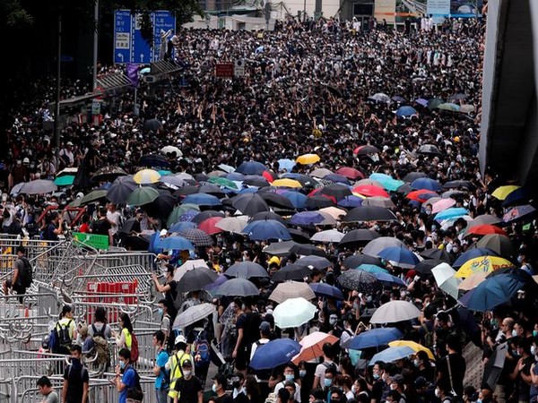 UPDATE 3-Hong Kong protesters, police clash as demonstrations target Chinese traders