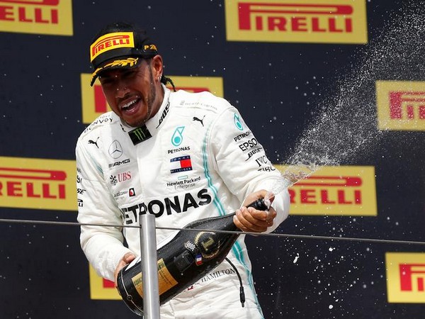 Motor racing-Hamilton powers to pole at Tuscan Grand Prix