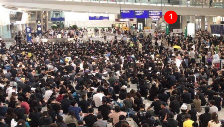 Hong Kong airport: Riot police moving in; more vans stationed outside