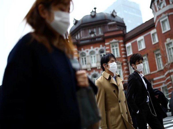 Wearing masks, French pilgrims send a message of hope ahead of religious feast