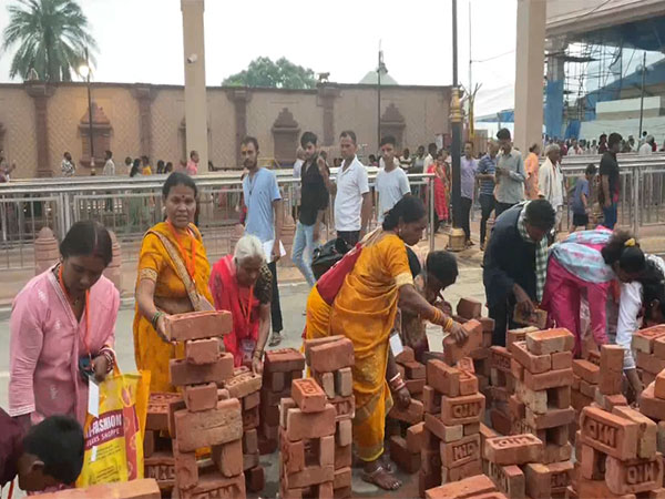 Devotees Flock to Ayodhya for Divine Blessings and Symbolic House Building