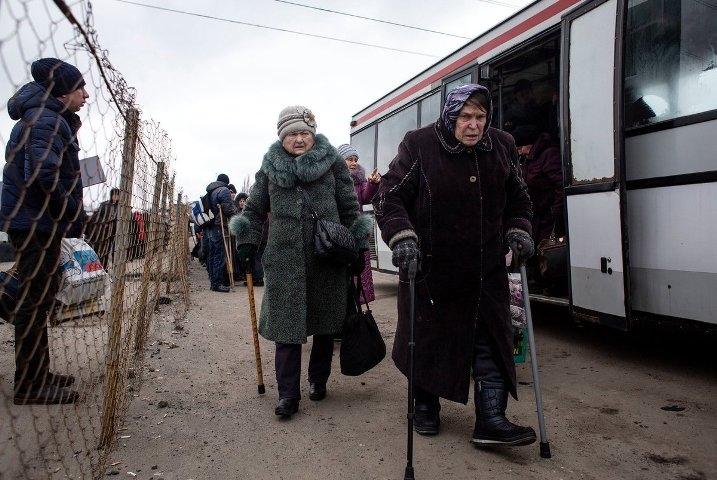 UPDATE 1-Clashes, jeers and burning tires greet coronavirus evacuees in Ukraine