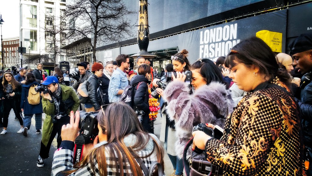 With glue and fake blood, climate protesters target London Fashion Week