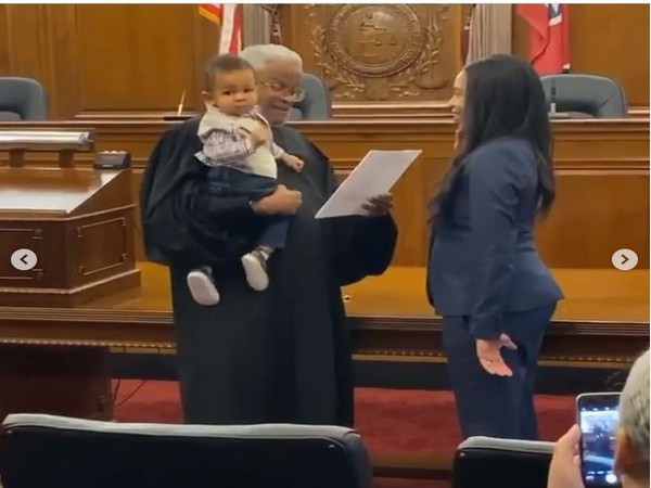 Mom takes oath to become lawyer while judge holds her baby, video goes viral