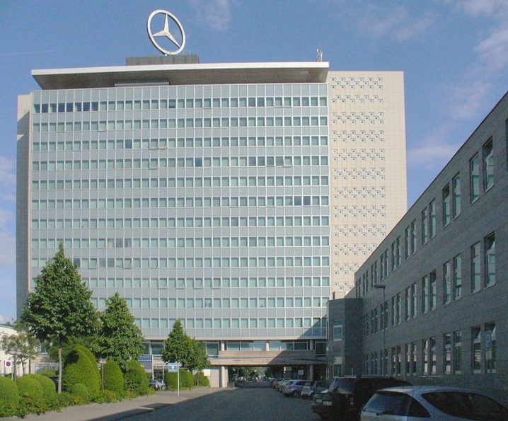 UPDATE 3-Daimler profits halve on diesel and restructuring charges
