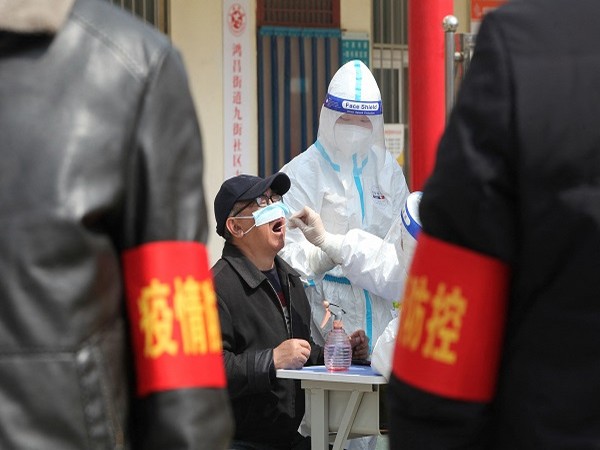China expands lockdowns as COVID-19 cases hit daily record