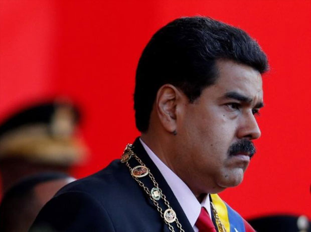 UPDATE 3-U.S. sanctions Venezuela officials, Trump slams Maduro