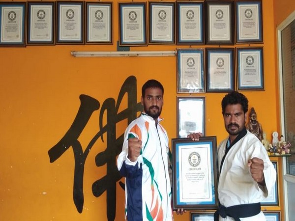 Blindfolded martial arts master from Andhra smashes 49 coconuts placed around student, creates Guinness World Record
