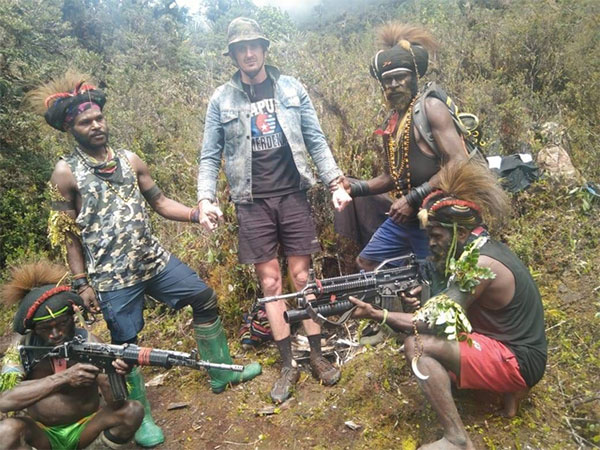 New Zealand hostage pilot appears in photos with armed West Papua rebels