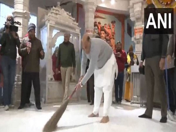 Defence Minister Rajnath Singh cleans Hanuman Setu temple in Lucknow ahead of Pran Pratishtha event