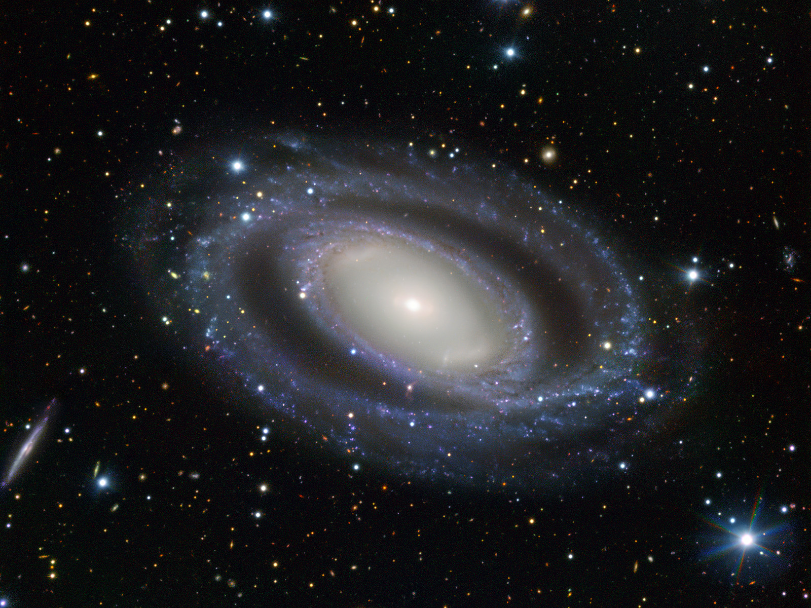 This intriguing spiral galaxy has numerous sets of double features: Check out this pic by ESO's VLT