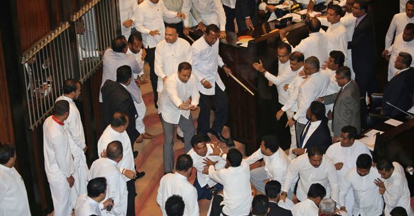 UPDATE 1-Sri Lanka parliament halts ministers' salaries to hinder disputed PM