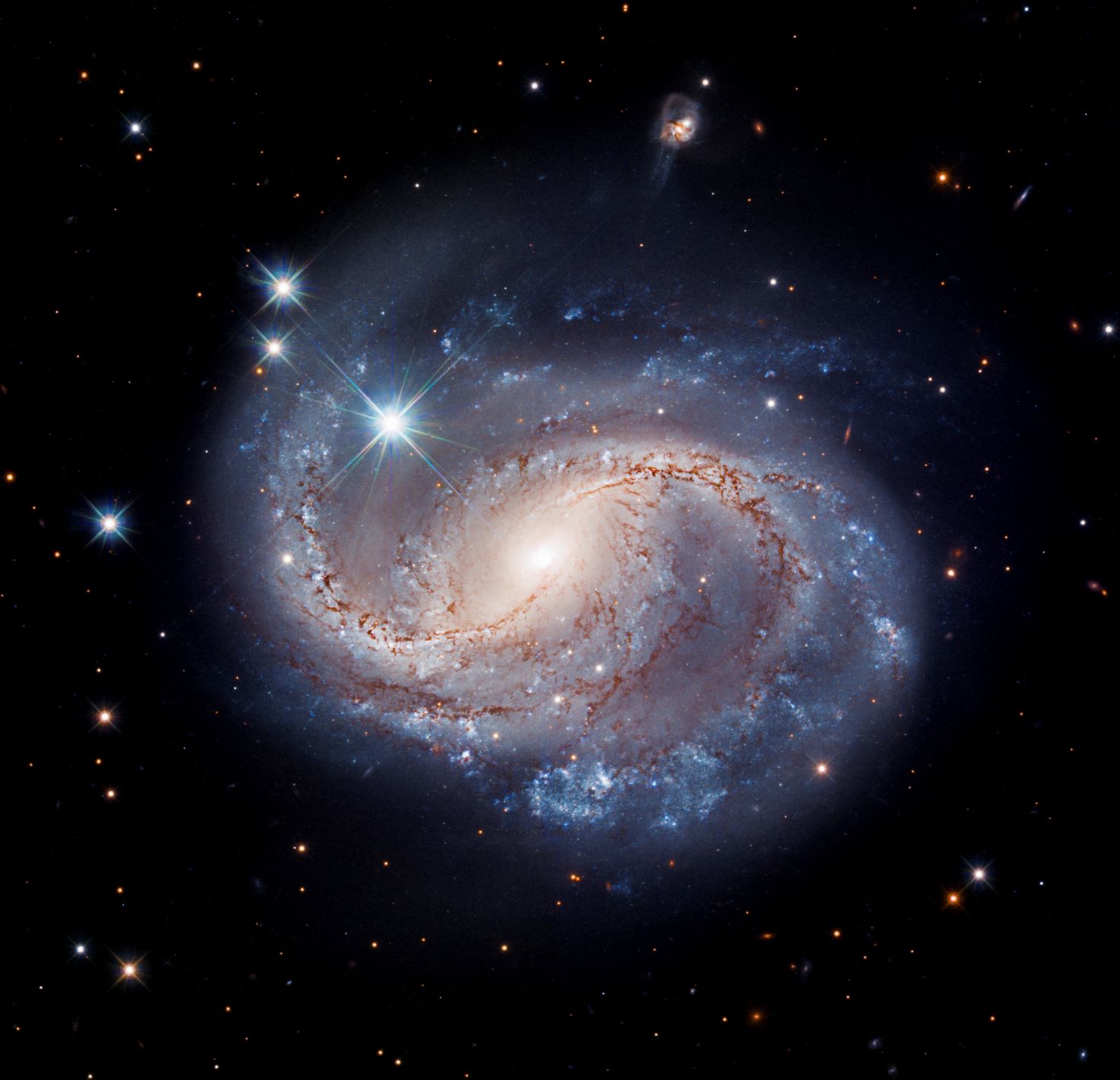 Blue swirls of spiral galaxy NGC 6956 stand out radiantly in this latest Hubble image