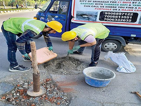 Youth take initiative to fix potholes, saving lives in Downtown Srinagar