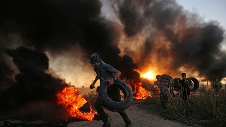 Israeli army retaliate after grenade attacks, protesting woman killed 