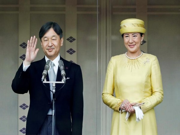 Cheering crowds greet Japan's new emperor in rare parade